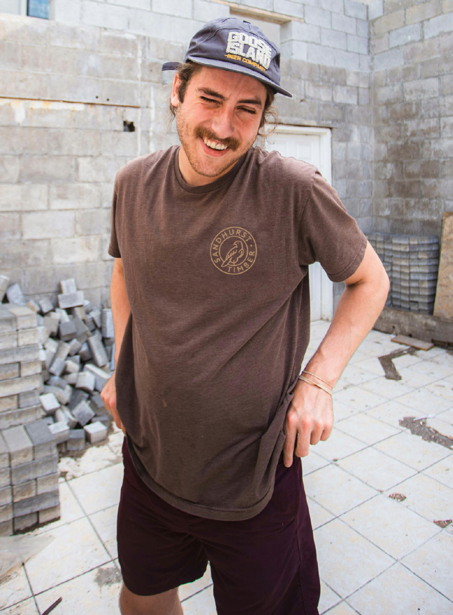 Sandhurst Timber bird mark printed on a staff shirt